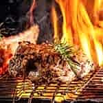 chef-cook-fries-meat-beef-steak-open-fire-restaurant_127425-660